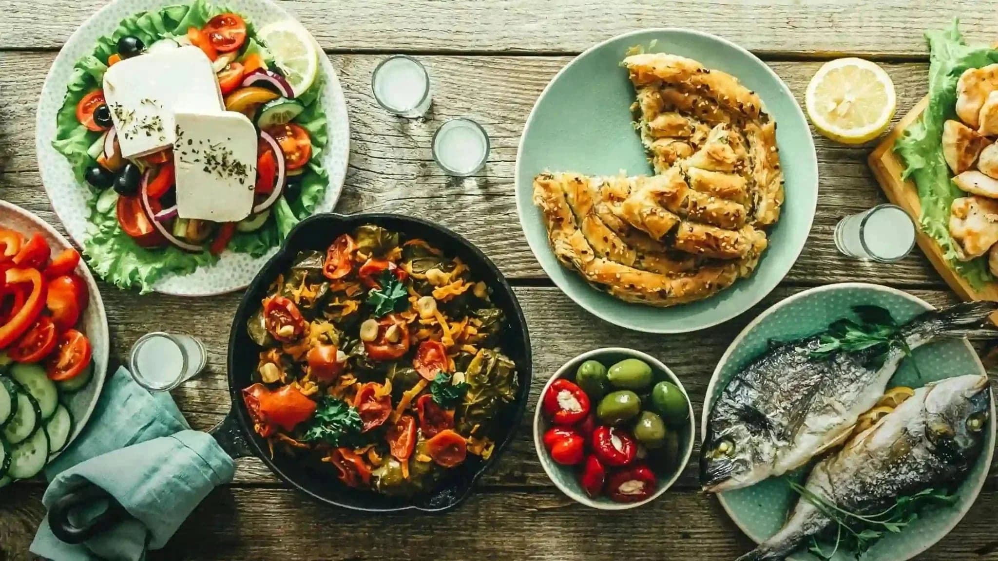 Traditional Greek food spread on a rustic table