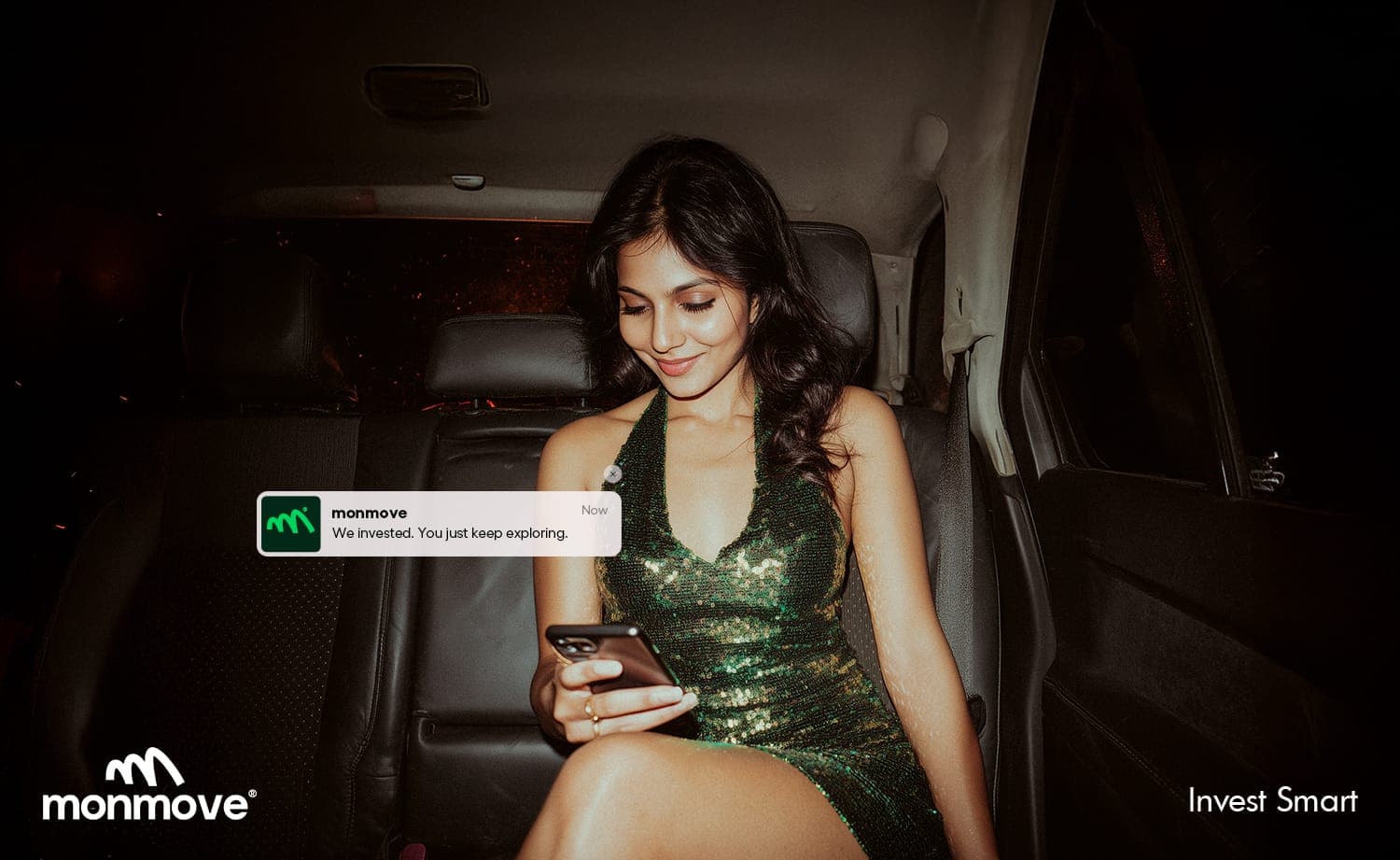 Monmove investment campaign visual with a woman in a car holding a phone