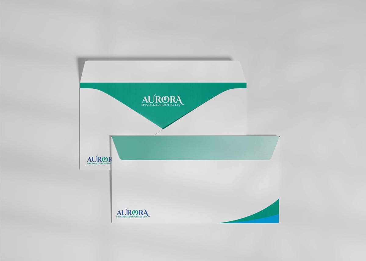 Aurora hospital branded envelope system on a light grey background